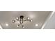 Modern six-light chandelier with glass globes at 10254 Morning Mist Ln, Sarasota, FL 34241