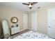 Bedroom with a full-length mirror and double doors at 10254 Morning Mist Ln, Sarasota, FL 34241