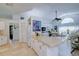 Open kitchen with white cabinets and island countertop at 5932 Java Plum Ln, Bradenton, FL 34203