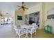 Covered patio with table and chairs, overlooking pool at 5932 Java Plum Ln, Bradenton, FL 34203