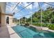 Screened pool and spa with fountain and lush landscaping at 5111 51St W Ln, Bradenton, FL 34210