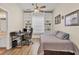 Bedroom with built-in shelves, desk, and daybed at 5111 51St W Ln, Bradenton, FL 34210