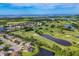 Wide aerial view of the community with waterfront and golf course at 5111 51St W Ln, Bradenton, FL 34210