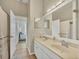 Double vanity bathroom with beige countertop and tiled floor at 5111 51St W Ln, Bradenton, FL 34210