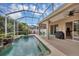 Enjoy this screened-in pool and lanai area with room for grilling at 5111 51St W Ln, Bradenton, FL 34210
