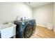 Convenient laundry room with Samsung washer and dryer at 2845 Indianwood Dr, Sarasota, FL 34232