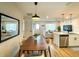 Open concept dining area with a modern wooden table and chairs at 2845 Indianwood Dr, Sarasota, FL 34232