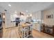 Renovated kitchen with white cabinets, kitchen island, and stainless steel appliances at 2611 Sunnyside St, Sarasota, FL 34239
