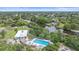 Community pool and waterway view from above at 2611 Sunnyside St, Sarasota, FL 34239