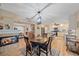 Bright dining room adjacent to the kitchen with a fireplace and access to the back patio at 2611 Sunnyside St, Sarasota, FL 34239