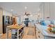 Updated kitchen with white cabinets, stainless steel appliances, and a large kitchen island at 2611 Sunnyside St, Sarasota, FL 34239