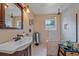 Updated bathroom with a walk-in shower, subway tile, and modern vanity at 2611 Sunnyside St, Sarasota, FL 34239