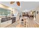 Modern kitchen with white cabinets, stainless steel appliances, and a large island at 2611 Sunnyside St, Sarasota, FL 34239