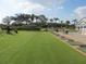 Golf driving range with golfers practicing their swings at 6611 Stone River Rd # 104, Bradenton, FL 34203