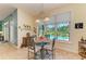 Breakfast nook with view of pool and lush landscaping at 7606 91St E St, Palmetto, FL 34221