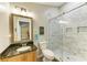 Updated bathroom with walk-in shower and granite vanity at 7606 91St E St, Palmetto, FL 34221