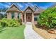 Charming two-story home with stone accents and landscaped yard at 7606 91St E St, Palmetto, FL 34221
