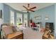 Bright home office features built-in shelving and large windows at 7606 91St E St, Palmetto, FL 34221