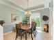 Bright dining room with wood table and chairs near window at 7606 91St E St, Palmetto, FL 34221