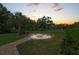 Relaxing fire pit area with seating, perfect for outdoor gatherings at 7606 91St E St, Palmetto, FL 34221