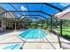 Inviting screened-in pool with a spacious patio and lounge area at 7606 91St E St, Palmetto, FL 34221