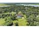 Aerial view showcasing home, pool, and surrounding landscape at 7606 91St E St, Palmetto, FL 34221