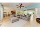 Open concept living room with sectional sofa and views to kitchen and dining area at 7606 91St E St, Palmetto, FL 34221