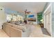 Bright and airy living room with a large sectional sofa and fireplace at 7606 91St E St, Palmetto, FL 34221
