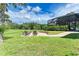 Backyard oasis with fire pit and screened pool area at 7606 91St E St, Palmetto, FL 34221