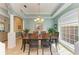 Formal dining room with wood table and chairs, and light walls at 7606 91St E St, Palmetto, FL 34221