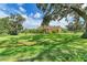 Home with a large yard and oak trees at 7606 91St E St, Palmetto, FL 34221
