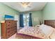 Bright bedroom with a queen-size bed and plenty of natural light at 7606 91St E St, Palmetto, FL 34221