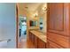 Double vanity bathroom with granite countertops and large mirror at 7606 91St E St, Palmetto, FL 34221