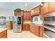 Spacious kitchen with stainless steel appliances and wood cabinets at 7606 91St E St, Palmetto, FL 34221