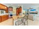 Eat-in kitchen features granite island and views into Gathering room at 7606 91St E St, Palmetto, FL 34221