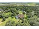 Bird's-eye view of a luxurious home surrounded by lush greenery at 7606 91St E St, Palmetto, FL 34221