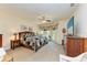 Spacious main bedroom with large windows and a TV at 7606 91St E St, Palmetto, FL 34221