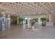 Elegant condo lobby with high ceilings and decorative plants at 5855 Midnight Pass Rd # 420, Sarasota, FL 34242