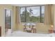 Main bedroom with a king-size bed and stunning views at 5855 Midnight Pass Rd # 420, Sarasota, FL 34242