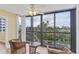 Relaxing balcony with wicker furniture and stunning water views at 5855 Midnight Pass Rd # 420, Sarasota, FL 34242