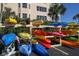 Community kayak storage with an array of colorful kayaks at 5855 Midnight Pass Rd # 420, Sarasota, FL 34242