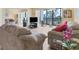 Condo living room with comfy sofas, TV, and balcony view at 5855 Midnight Pass Rd # 420, Sarasota, FL 34242