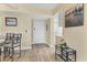 Bright condo entryway with wood-look flooring and dining area at 5855 Midnight Pass Rd # 420, Sarasota, FL 34242