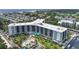 Aerial view of the building, pool, and surrounding area at 5855 Midnight Pass Rd # 420, Sarasota, FL 34242