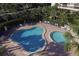 Resort-style pool with spacious deck and lounge chairs at 5855 Midnight Pass Rd # 420, Sarasota, FL 34242