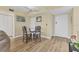 Small dining area with glass table and four chairs at 5855 Midnight Pass Rd # 420, Sarasota, FL 34242