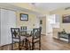 Bright dining area with glass-top table and four chairs at 5855 Midnight Pass Rd # 420, Sarasota, FL 34242