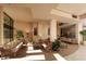 Relaxing lobby sitting area with wicker furniture and large windows at 5855 Midnight Pass Rd # 420, Sarasota, FL 34242