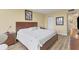 Bright bedroom with king-size bed and built-in closets at 5855 Midnight Pass Rd # 420, Sarasota, FL 34242