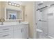 Updated bathroom with white vanity and walk-in shower at 5855 Midnight Pass Rd # 420, Sarasota, FL 34242